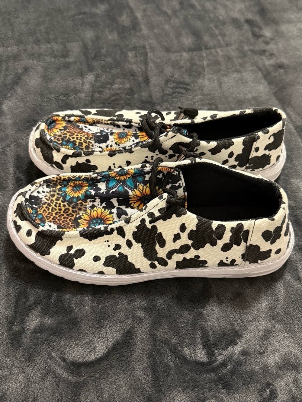 Women’s Cow-Print Slip-On Sneakers with Floral Insole - Black & White